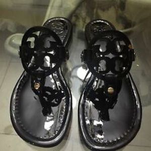 shiny black flip flops